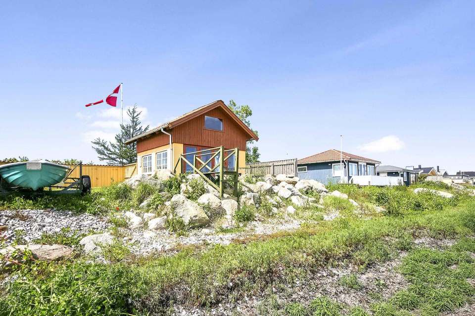 This tiny beachfront cottage in Denmark has 172 sq ft on the ground floor plus a sleeping loft. | www.facebook.com/SmallHouseBliss