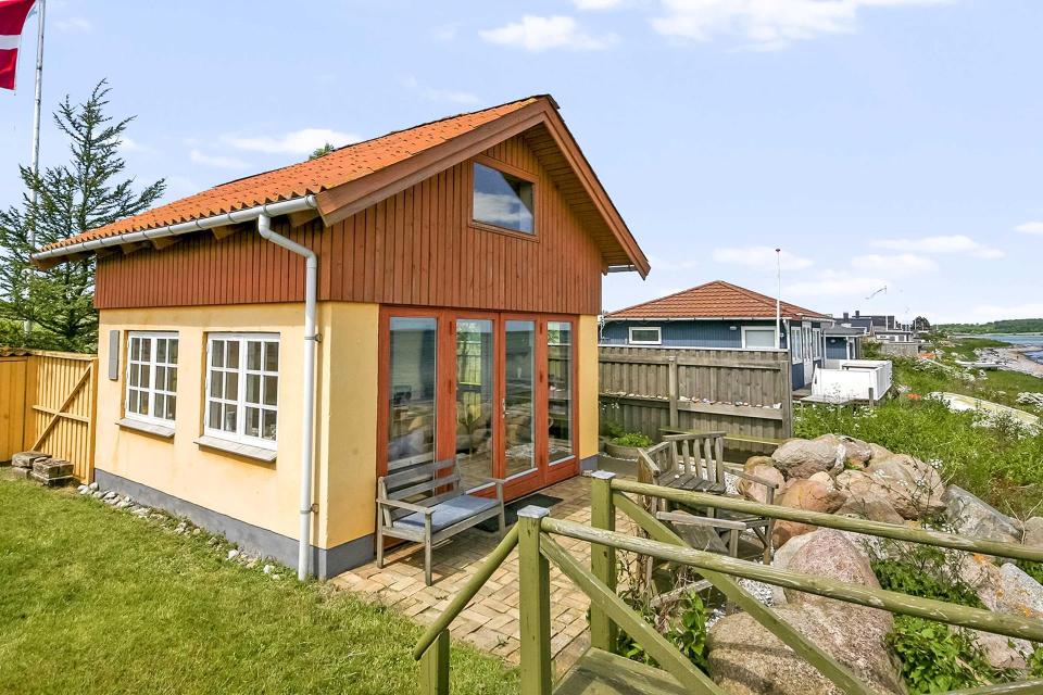 This tiny beachfront cottage in Denmark has 172 sq ft on the ground floor plus a sleeping loft. | www.facebook.com/SmallHouseBliss