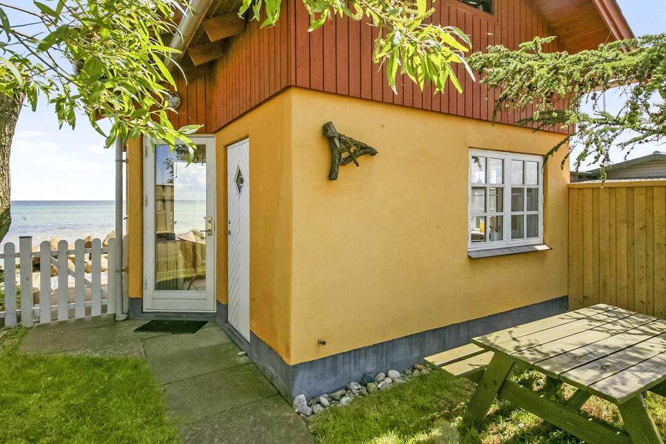 This tiny beachfront cottage in Denmark has 172 sq ft on the ground floor plus a sleeping loft. | www.facebook.com/SmallHouseBliss