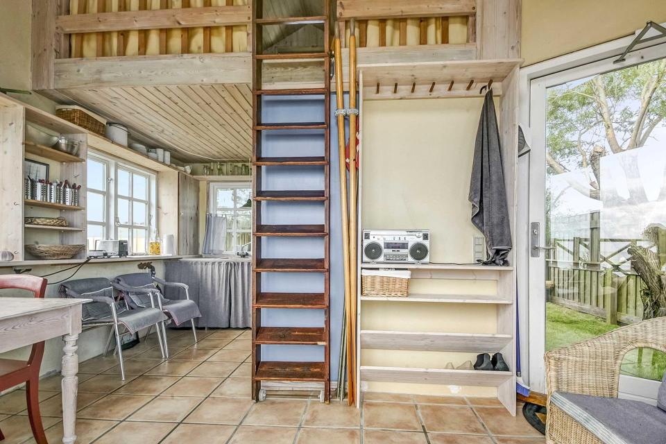 This tiny beachfront cottage in Denmark has 172 sq ft on the ground floor plus a sleeping loft. | www.facebook.com/SmallHouseBliss