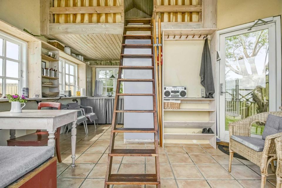 This tiny beachfront cottage in Denmark has 172 sq ft on the ground floor plus a sleeping loft. | www.facebook.com/SmallHouseBliss