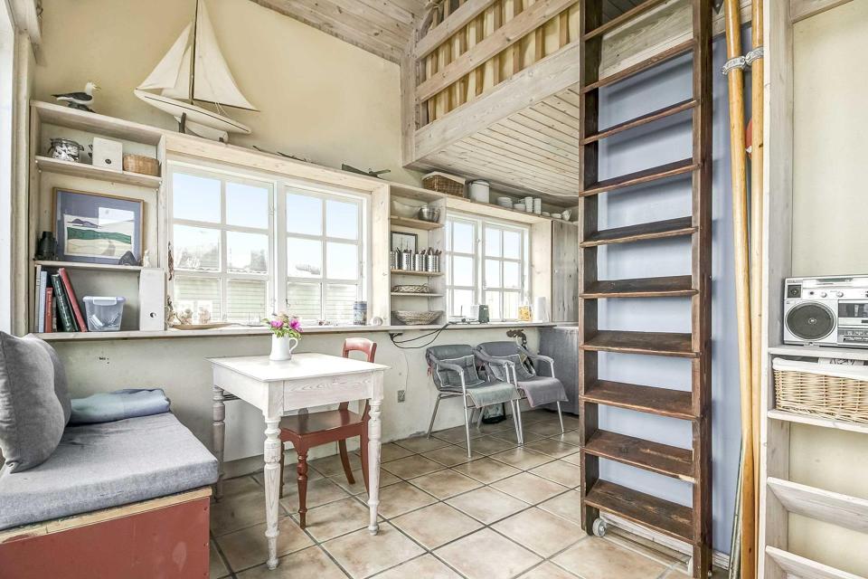 This tiny beachfront cottage in Denmark has 172 sq ft on the ground floor plus a sleeping loft. | www.facebook.com/SmallHouseBliss