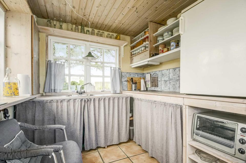 This tiny beachfront cottage in Denmark has 172 sq ft on the ground floor plus a sleeping loft. | www.facebook.com/SmallHouseBliss