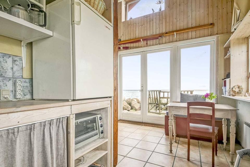This tiny beachfront cottage in Denmark has 172 sq ft on the ground floor plus a sleeping loft. | www.facebook.com/SmallHouseBliss