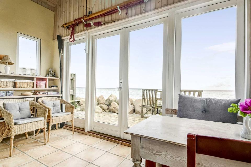 This tiny beachfront cottage in Denmark has 172 sq ft on the ground floor plus a sleeping loft. | www.facebook.com/SmallHouseBliss