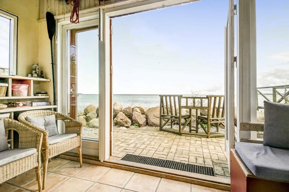 This tiny beachfront cottage in Denmark has 172 sq ft on the ground floor plus a sleeping loft. | www.facebook.com/SmallHouseBliss