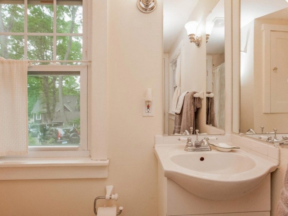 This 1943 shingled cottage in Connecticut has one bedroom on the 400 sq ft main floor plus a loft. | www.facebook.com/SmallHouseBliss