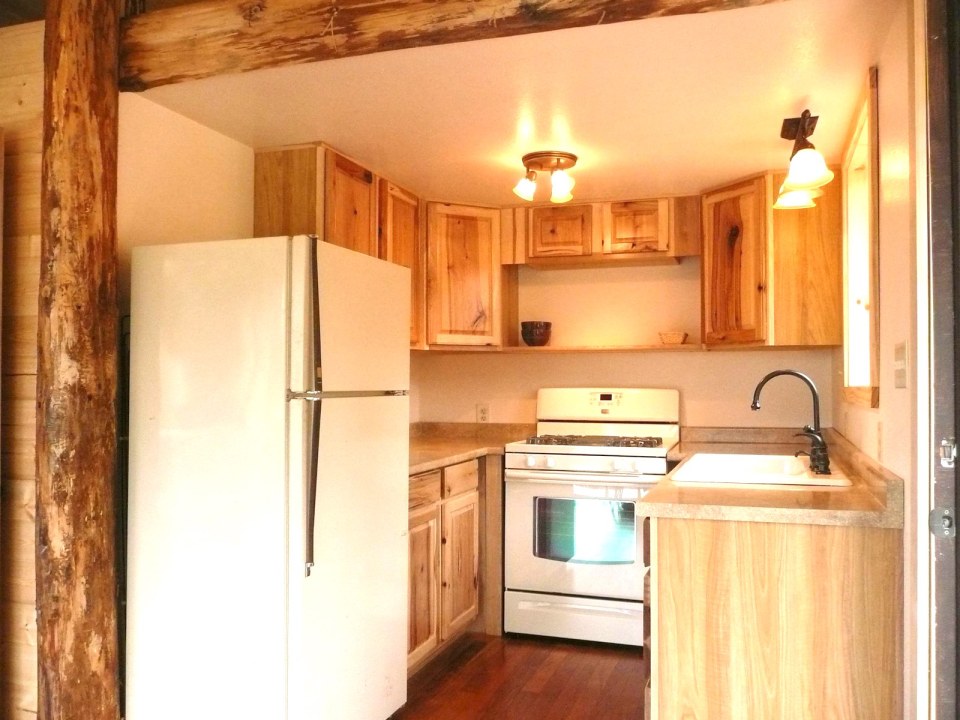 The Pond Cottage, a small cabin tucked into a secluded forest meadow. Inside it has 400 sq ft on the main floor plus a loft bedroom. | www.facebook.com/SmallHouseBliss