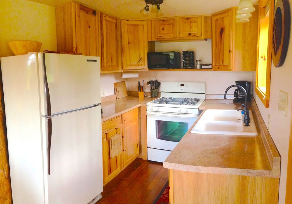 The Pond Cottage, a small cabin tucked into a secluded forest meadow. Inside it has 400 sq ft on the main floor plus a loft bedroom. | www.facebook.com/SmallHouseBliss