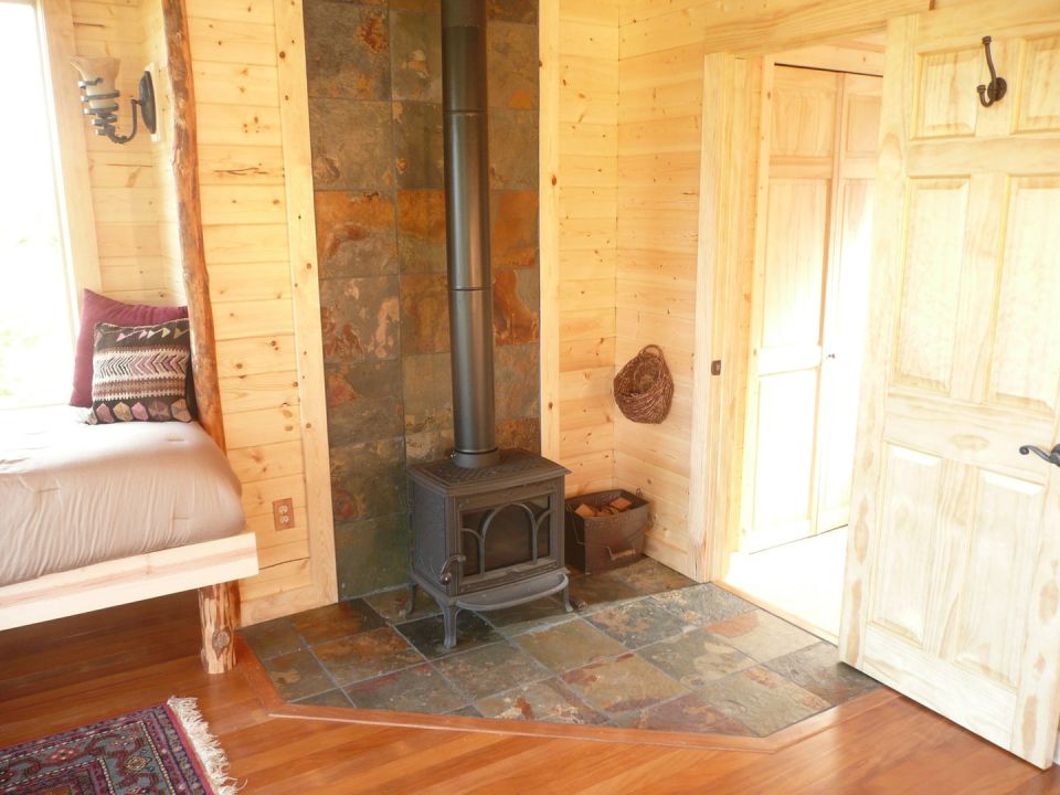 The Pond Cottage, a small cabin tucked into a secluded forest meadow. Inside it has 400 sq ft on the main floor plus a loft bedroom. | www.facebook.com/SmallHouseBliss