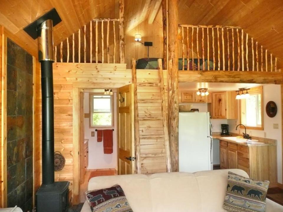 The Pond Cottage, a small cabin tucked into a secluded forest meadow. Inside it has 400 sq ft on the main floor plus a loft bedroom. | www.facebook.com/SmallHouseBliss