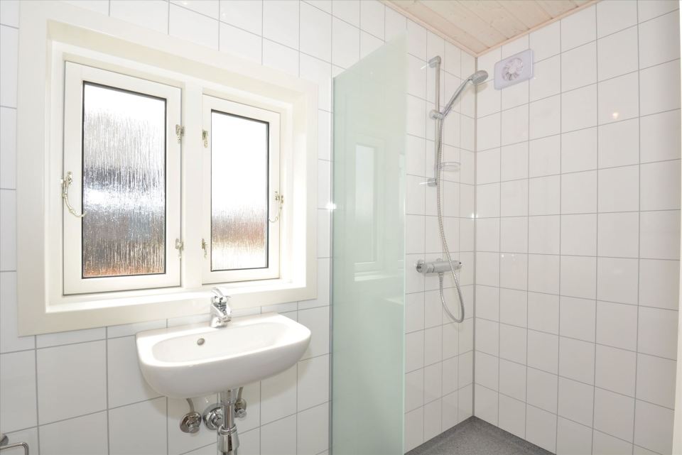 This Danish summerhouse was inspired by the neighboring fishermen's sheds. It has one bedroom on the 375 sq ft ground floor, plus a sleeping loft. | www.facebook.com/SmallHouseBliss