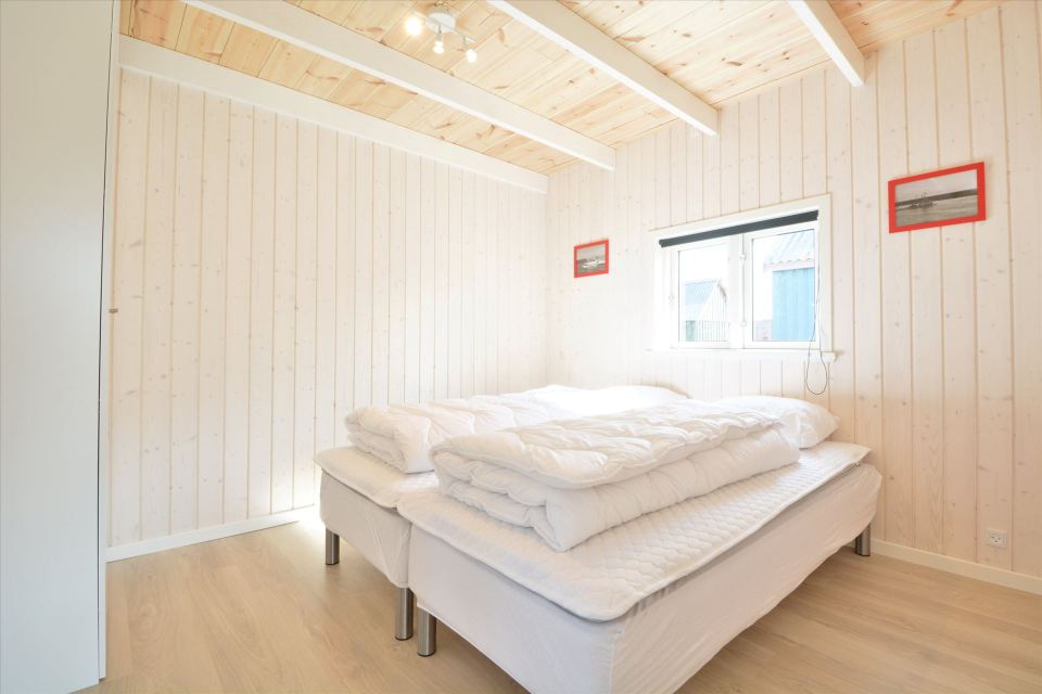 This Danish summerhouse was inspired by the neighboring fishermen's sheds. It has one bedroom on the 375 sq ft ground floor, plus a sleeping loft. | www.facebook.com/SmallHouseBliss