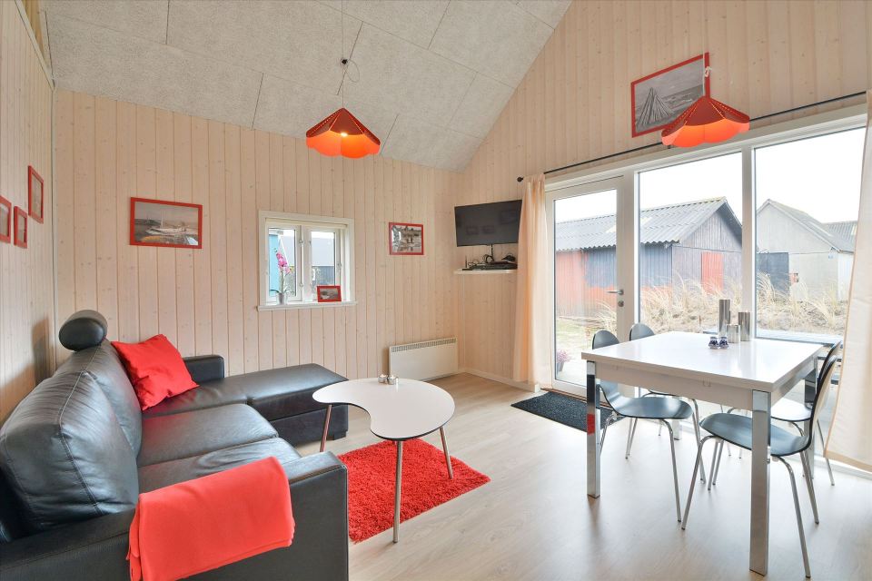 This Danish summerhouse was inspired by the neighboring fishermen's sheds. It has one bedroom on the 375 sq ft ground floor, plus a sleeping loft. | www.facebook.com/SmallHouseBliss