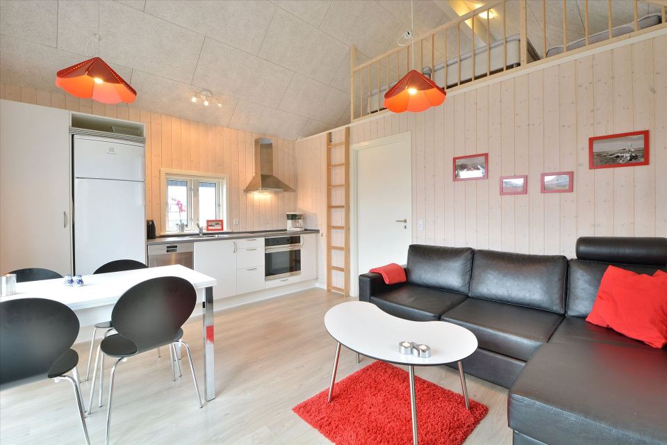 This Danish summerhouse was inspired by the neighboring fishermen's sheds. It has one bedroom on the 375 sq ft ground floor, plus a sleeping loft. | www.facebook.com/SmallHouseBliss