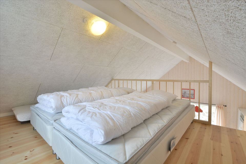 This Danish summerhouse was inspired by the neighboring fishermen's sheds. It has one bedroom on the 375 sq ft ground floor, plus a sleeping loft. | www.facebook.com/SmallHouseBliss