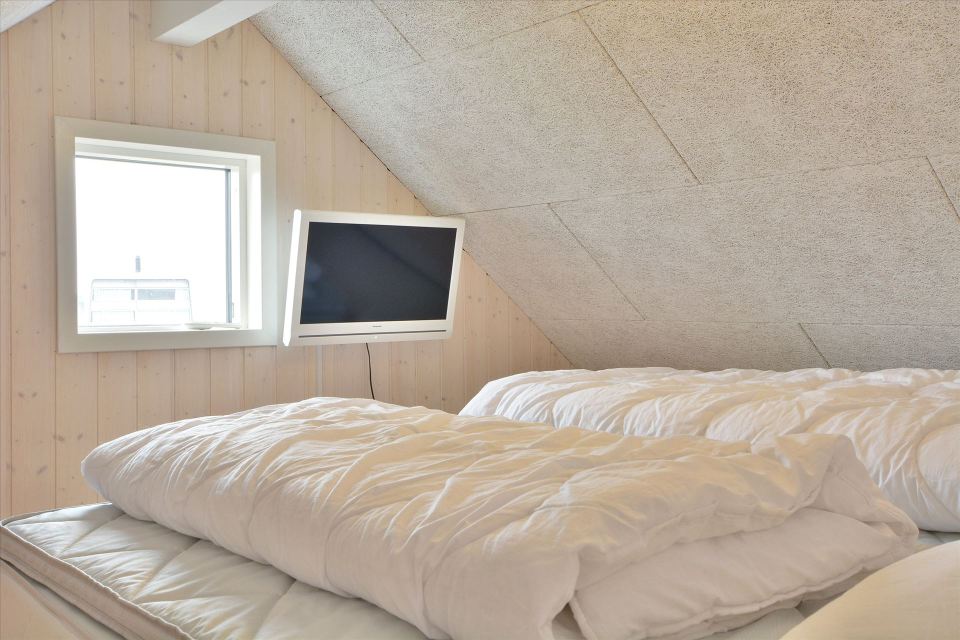 This Danish summerhouse was inspired by the neighboring fishermen's sheds. It has one bedroom on the 375 sq ft ground floor, plus a sleeping loft. | www.facebook.com/SmallHouseBliss