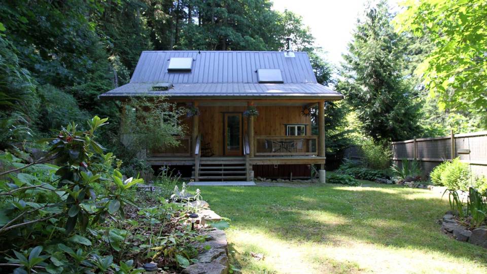 Birds' Hill Cottage is nestled in the rainforest on BC's Salt Spring Island. It has a ground-floor bedroom plus a large bedroom loft in roughly 800 sq ft. | www.facebook.com/SmallHouseBliss