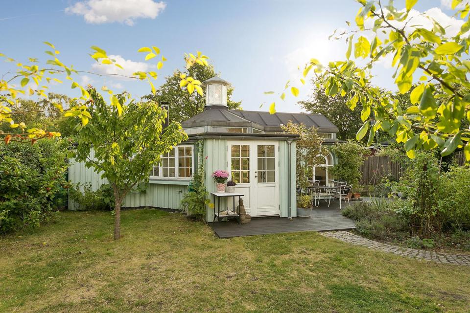 This fanciful allotment hut in Denmark has a tiny bedroom, a sleeping alcove and a sleeping loft in its 645 sq ft. | www.facebook.com/SmallHouseBliss