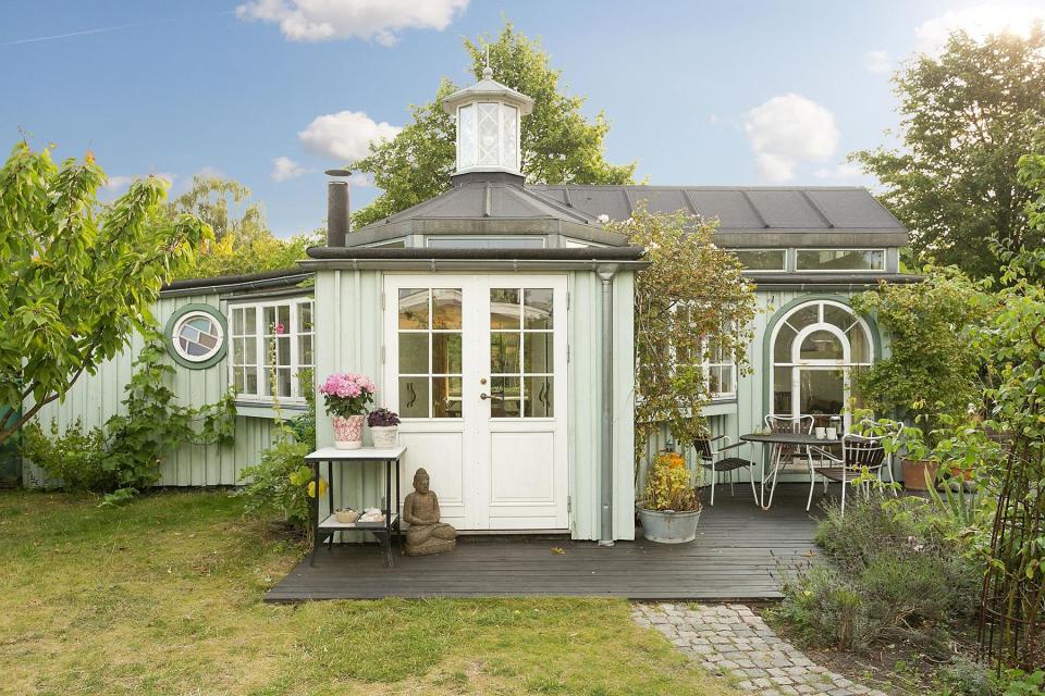 This fanciful allotment hut in Denmark has a tiny bedroom, a sleeping alcove and a sleeping loft in its 645 sq ft. | www.facebook.com/SmallHouseBliss