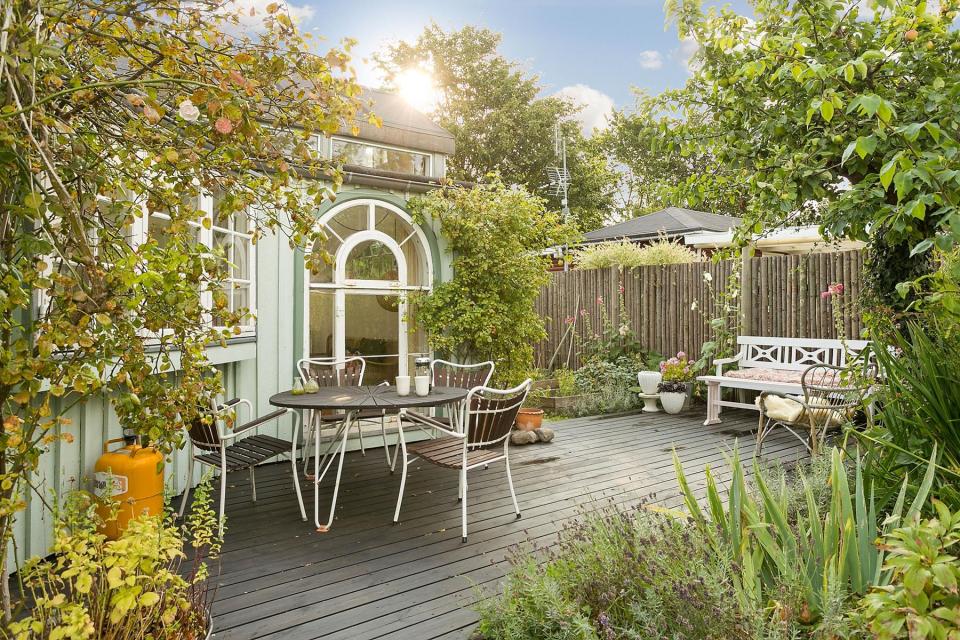 This fanciful allotment hut in Denmark has a tiny bedroom, a sleeping alcove and a sleeping loft in its 645 sq ft. | www.facebook.com/SmallHouseBliss