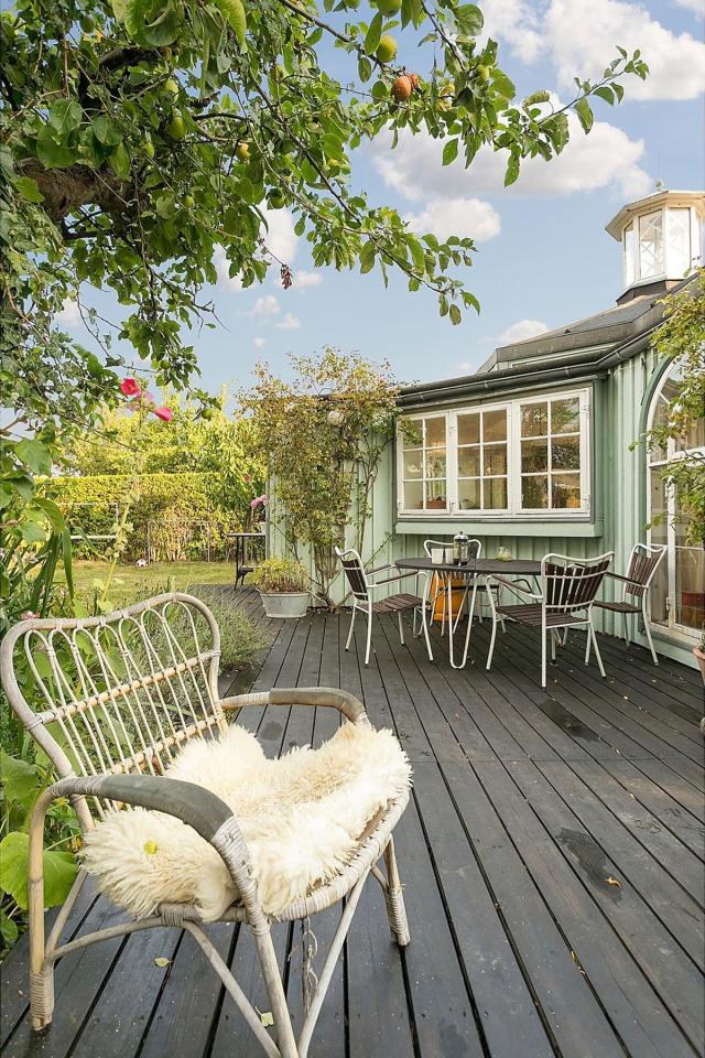This fanciful allotment hut in Denmark has a tiny bedroom, a sleeping alcove and a sleeping loft in its 645 sq ft. | www.facebook.com/SmallHouseBliss