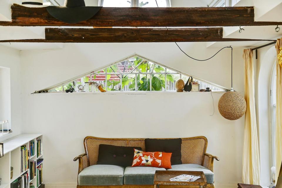 This fanciful allotment hut in Denmark has a tiny bedroom, a sleeping alcove and a sleeping loft in its 645 sq ft. | www.facebook.com/SmallHouseBliss