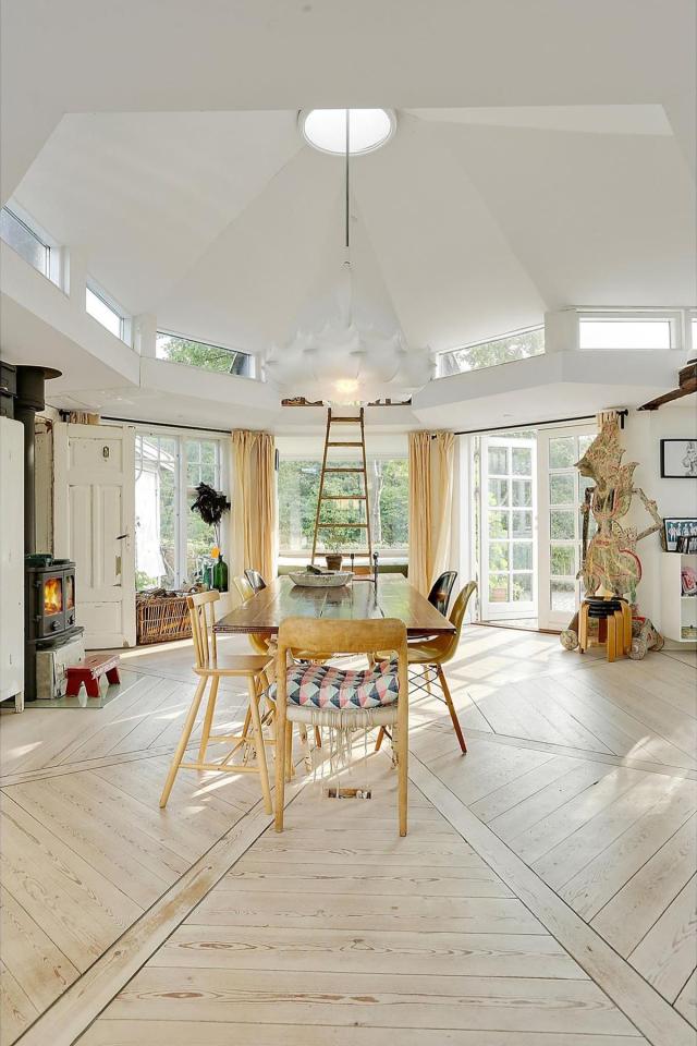 This fanciful allotment hut in Denmark has a tiny bedroom, a sleeping alcove and a sleeping loft in its 645 sq ft. | www.facebook.com/SmallHouseBliss