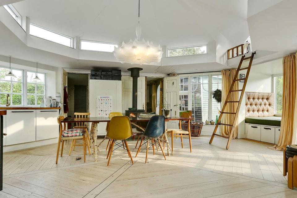 This fanciful allotment hut in Denmark has a tiny bedroom, a sleeping alcove and a sleeping loft in its 645 sq ft. | www.facebook.com/SmallHouseBliss