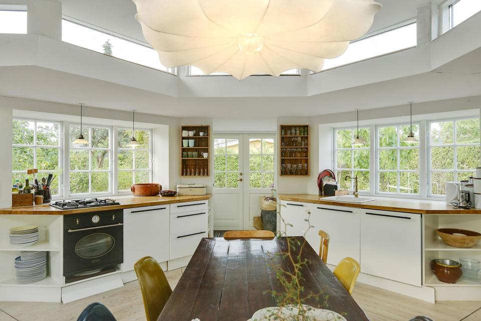 This fanciful allotment hut in Denmark has a tiny bedroom, a sleeping alcove and a sleeping loft in its 645 sq ft. | www.facebook.com/SmallHouseBliss