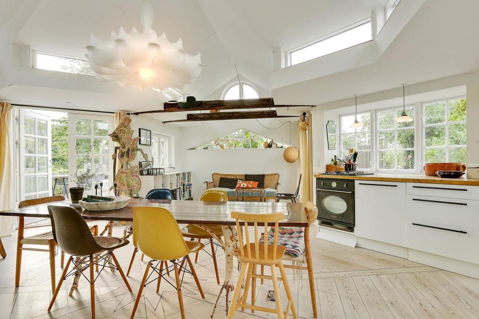 This fanciful allotment hut in Denmark has a tiny bedroom, a sleeping alcove and a sleeping loft in its 645 sq ft. | www.facebook.com/SmallHouseBliss