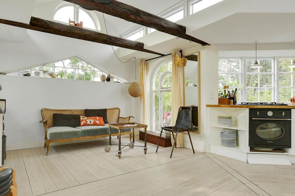 This fanciful allotment hut in Denmark has a tiny bedroom, a sleeping alcove and a sleeping loft in its 645 sq ft. | www.facebook.com/SmallHouseBliss