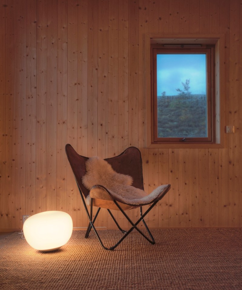 This modern wood cabin sits on the rugged coast of Norway. It has a bedroom, a sleeping nook and a loft, all in a footprint of just 645 sq ft. | www.facebook.com/SmallHouseBliss
