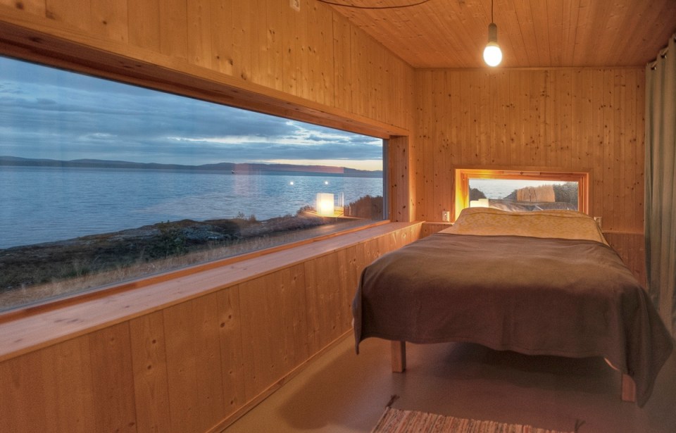 This modern wood cabin sits on the rugged coast of Norway. It has a bedroom, a sleeping nook and a loft, all in a footprint of just 645 sq ft. | www.facebook.com/SmallHouseBliss
