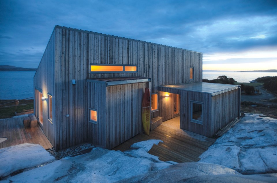 This modern wood cabin sits on the rugged coast of Norway. It has a bedroom, a sleeping nook and a loft, all in a footprint of just 645 sq ft. | www.facebook.com/SmallHouseBliss
