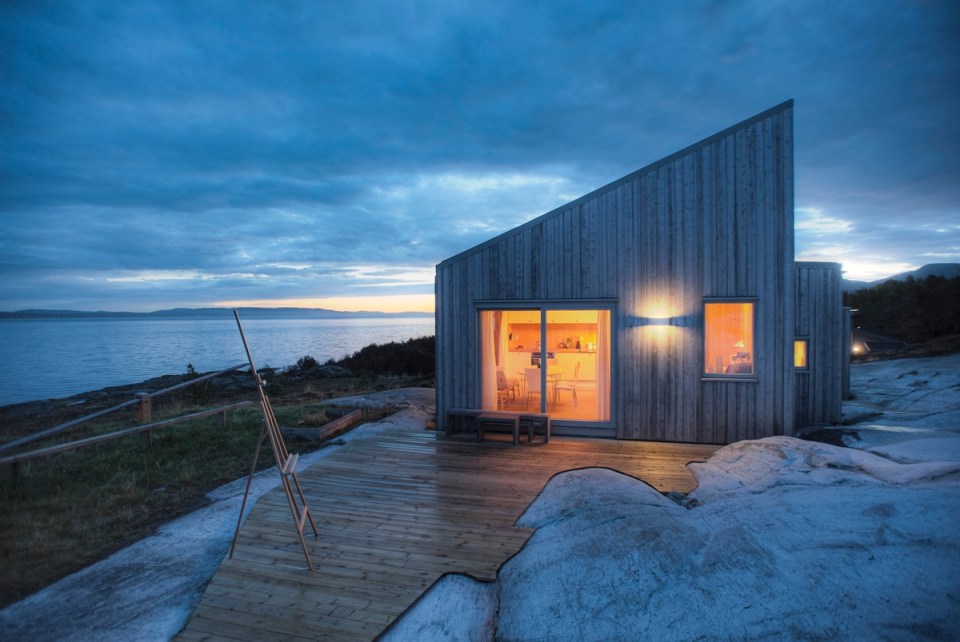 This modern wood cabin sits on the rugged coast of Norway. It has a bedroom, a sleeping nook and a loft, all in a footprint of just 645 sq ft. | www.facebook.com/SmallHouseBliss