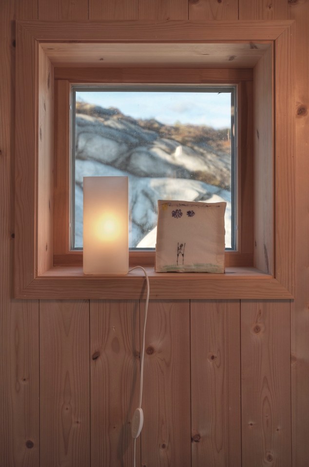This modern wood cabin sits on the rugged coast of Norway. It has a bedroom, a sleeping nook and a loft, all in a footprint of just 645 sq ft. | www.facebook.com/SmallHouseBliss