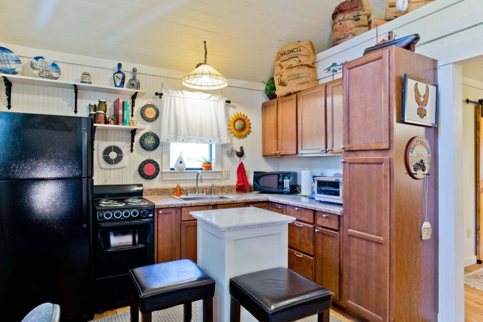 The "Tale Inn", a Southern-style one-bedroom cottage with pleasing proportions, welcoming front porch and authentic architectural details. | www.facebook.com/SmallHouseBliss